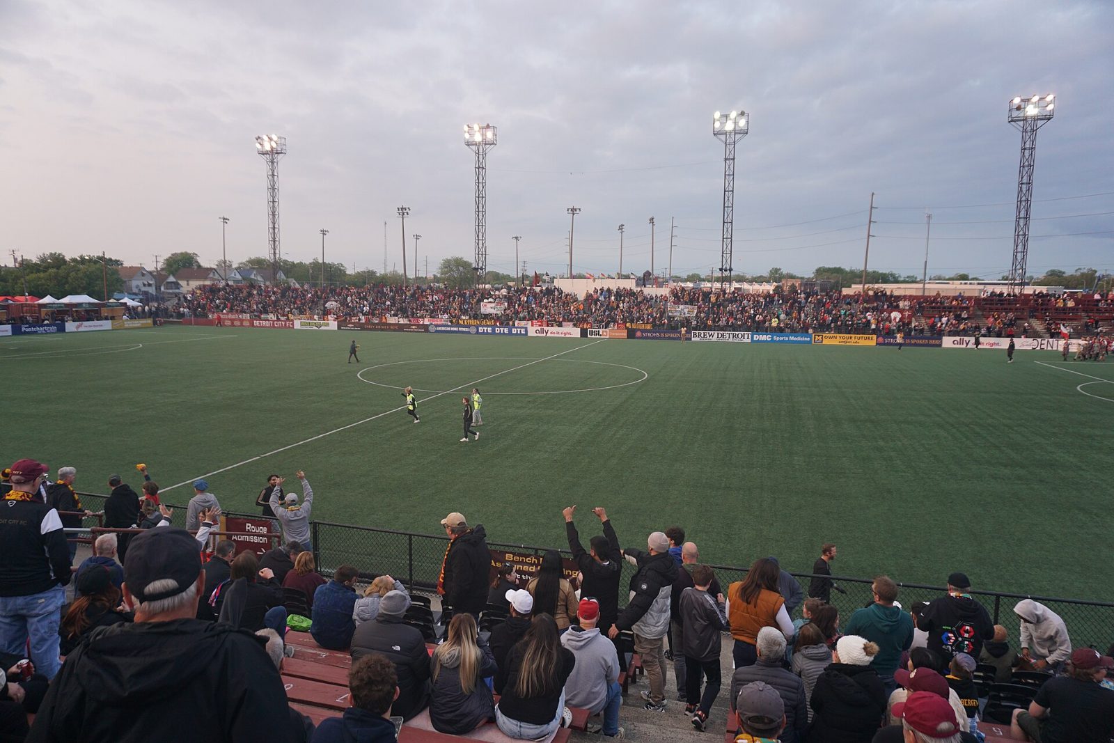 Keyworth Stadium at dusk, four light towers over a full grandstand